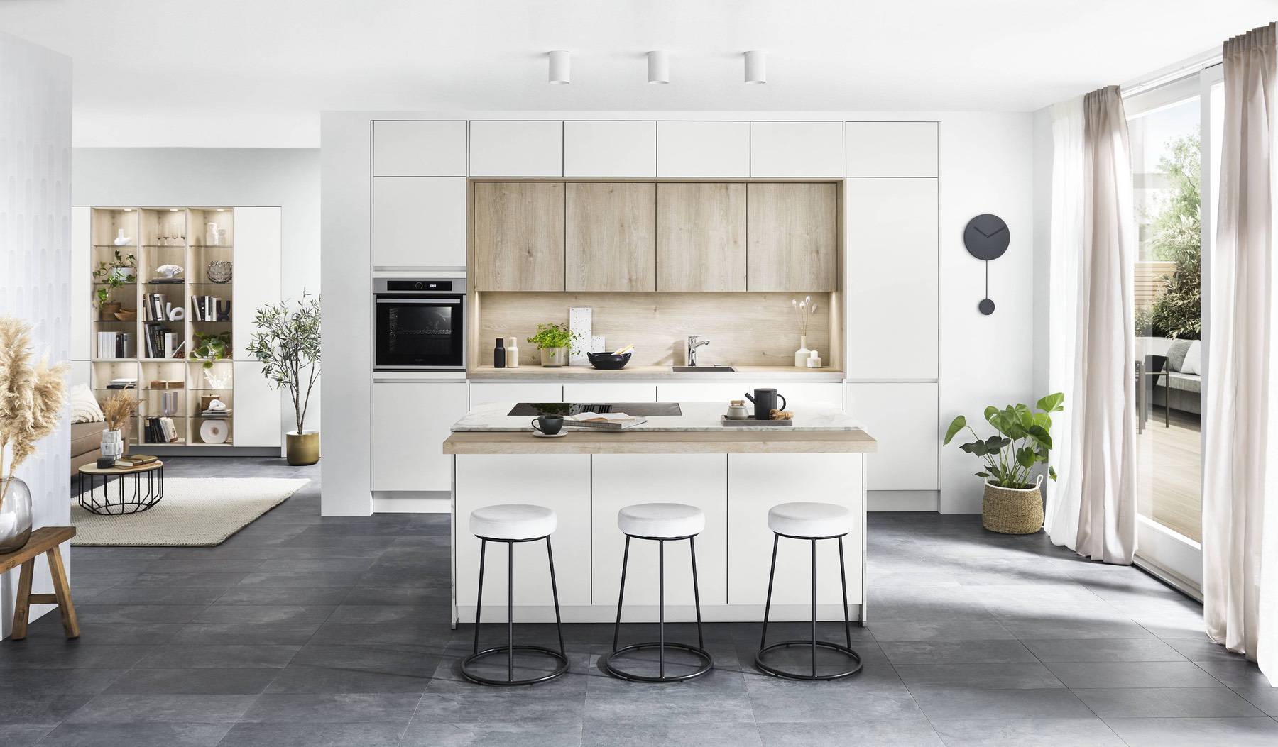 A warm kitchen colour scheme combining white cabinetry with natural wood finishes for added texture and depth. | My Kitchen Specialist